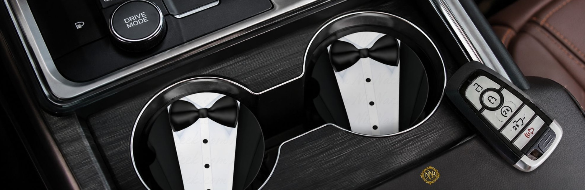 Set of two tuxedo-inspired ceramic car coasters displayed inside luxury vehicle cup holders with elegant black bowtie artwork and modern NicNacBooteek styling.