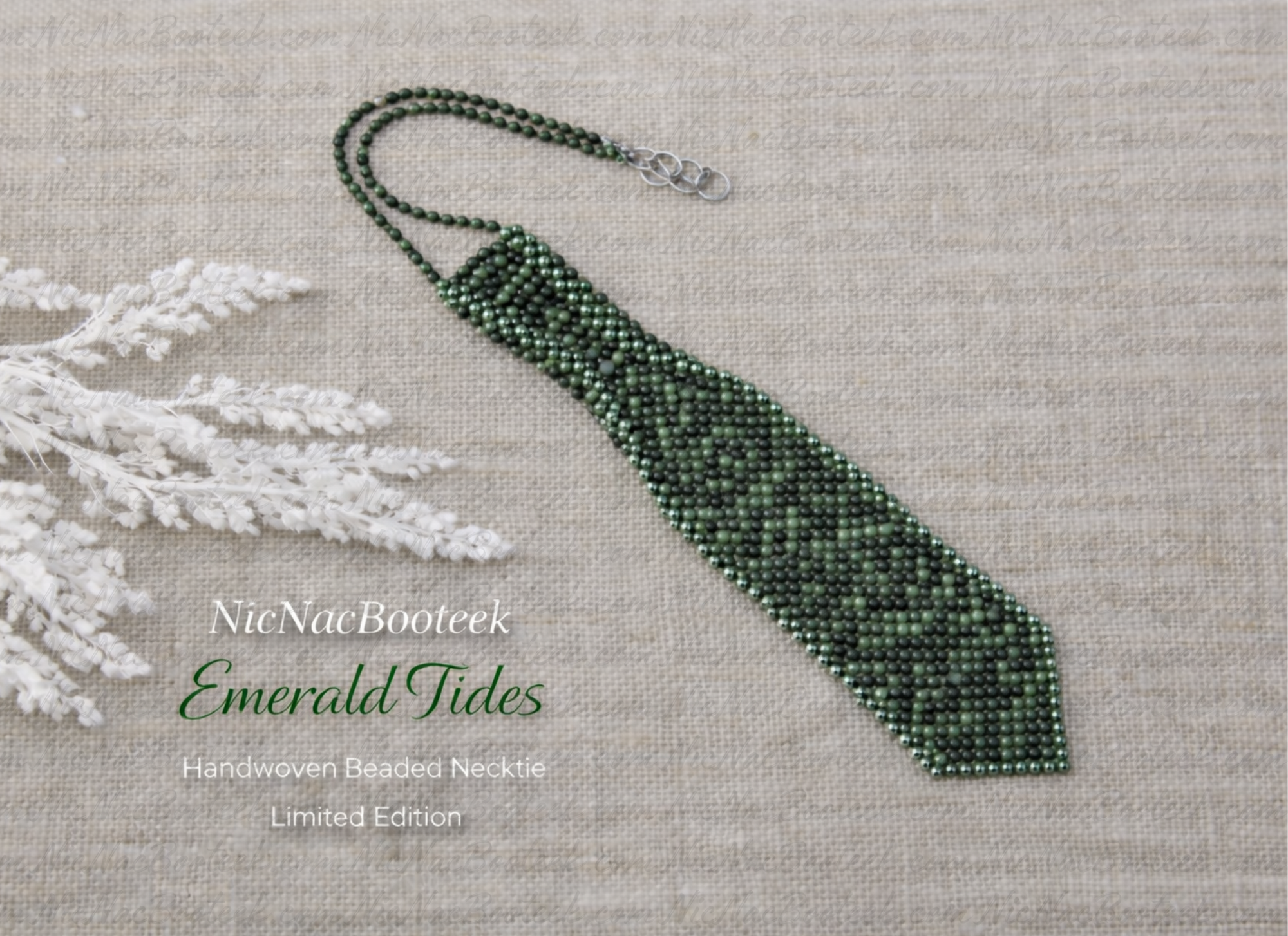 Handwoven green beaded necktie in Emerald Tides on neutral linen background