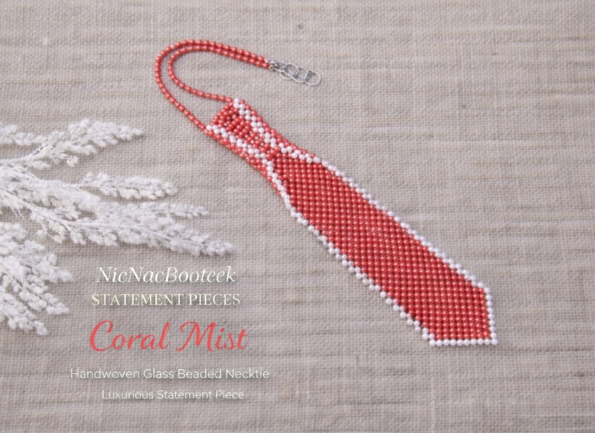 Handwoven glass beaded necktie in Coral Mist on neutral linen background