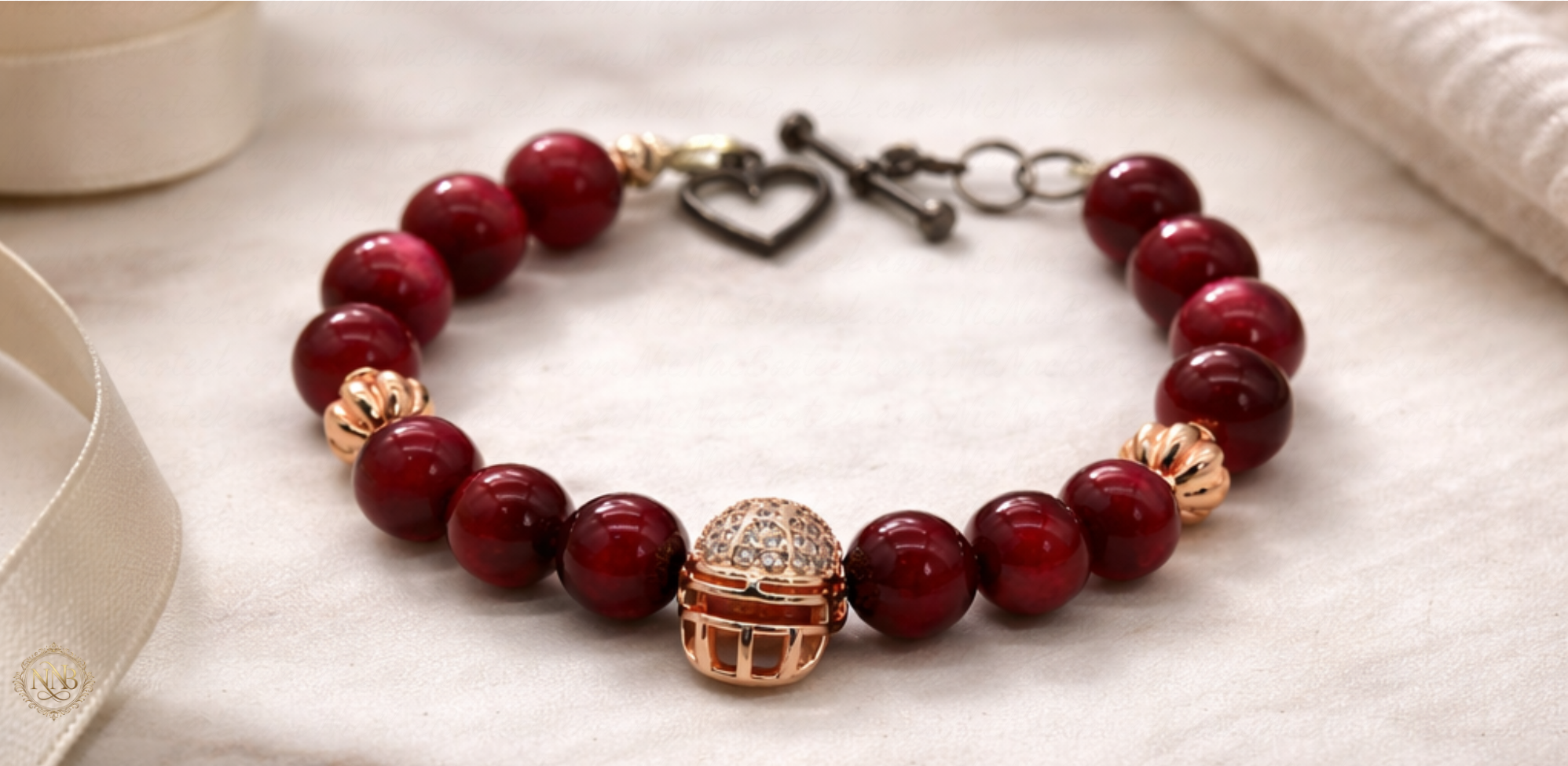 Luxury rose ascension beaded bracelet with rose gold focal bead on soft neutral linen background.