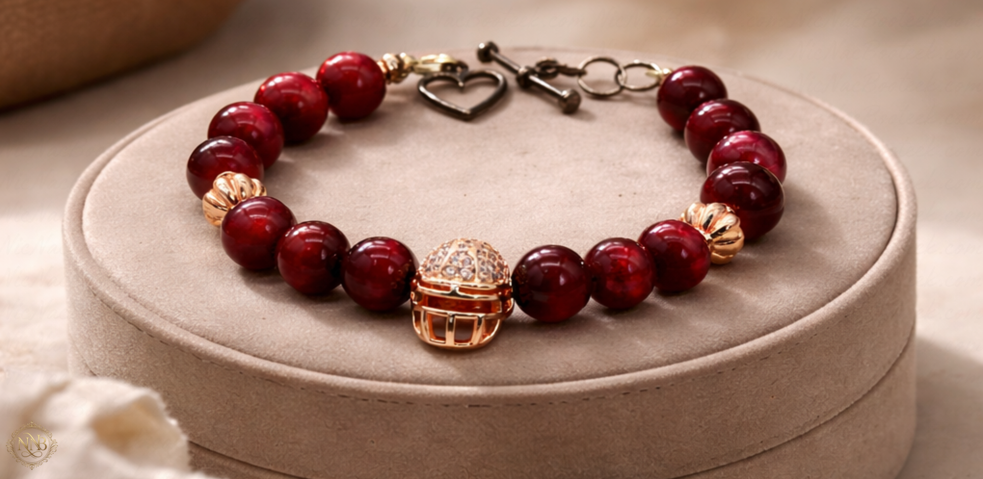 Rose Ascension bracelet displayed on beige suede pedestal with rose gold accents.