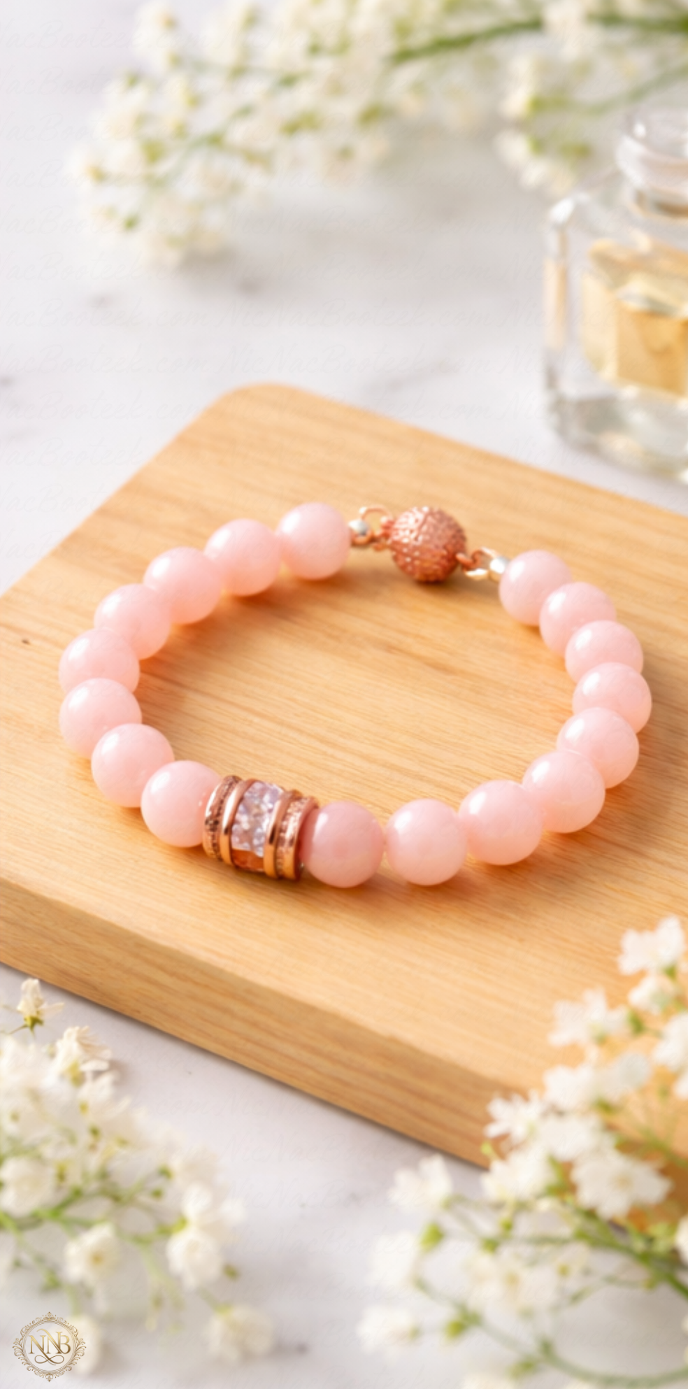 Light pink jade chalcedony bracelet styled with rose gold accents and soft neutral décor.