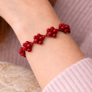 Scarlet Bloom Bracelet featuring handwoven red beadwork and silver heart toggle clasp with luxury handmade styling.