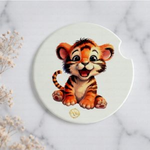 Tiny Tiger ceramic car coaster styled on a soft ivory marble background with delicate dried florals and clean luxury aesthetic.