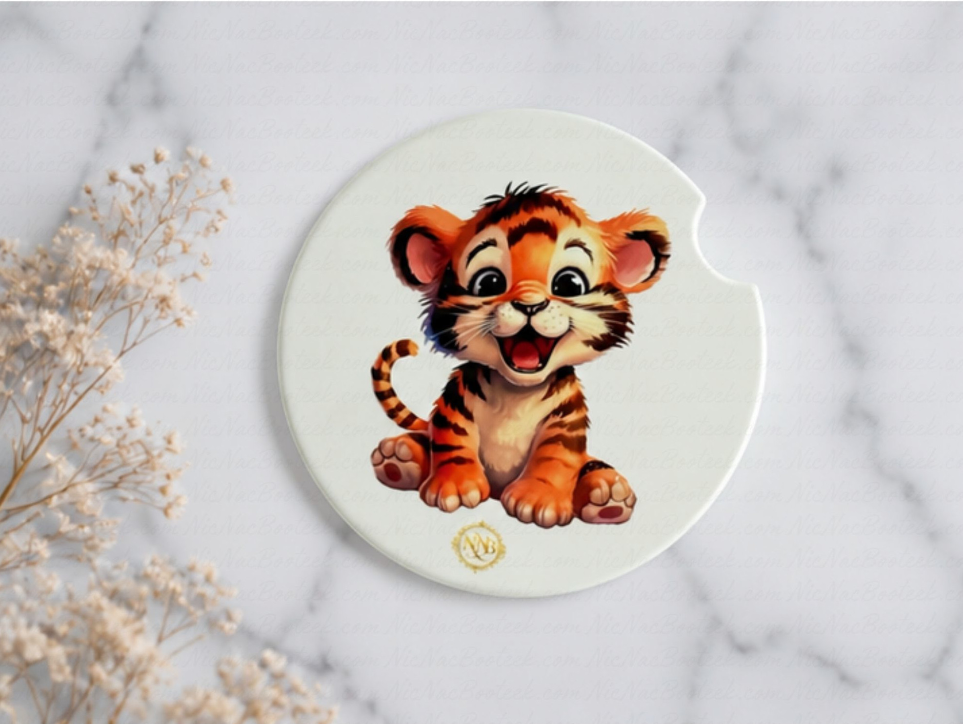 Tiny Tiger ceramic car coaster styled on a soft ivory marble background with delicate dried florals and clean luxury aesthetic.