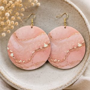 Blush Veil Statement Earrings styled in a ceramic dish featuring soft blush marble artwork with delicate gold veining and elegant gold-tone hooks by NicNacBooteek.