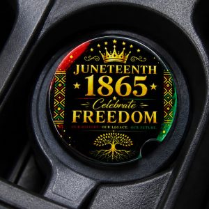 Luxury Juneteenth ceramic car coaster with gold typography and Pan-African inspired accents displayed inside vehicle cup holder