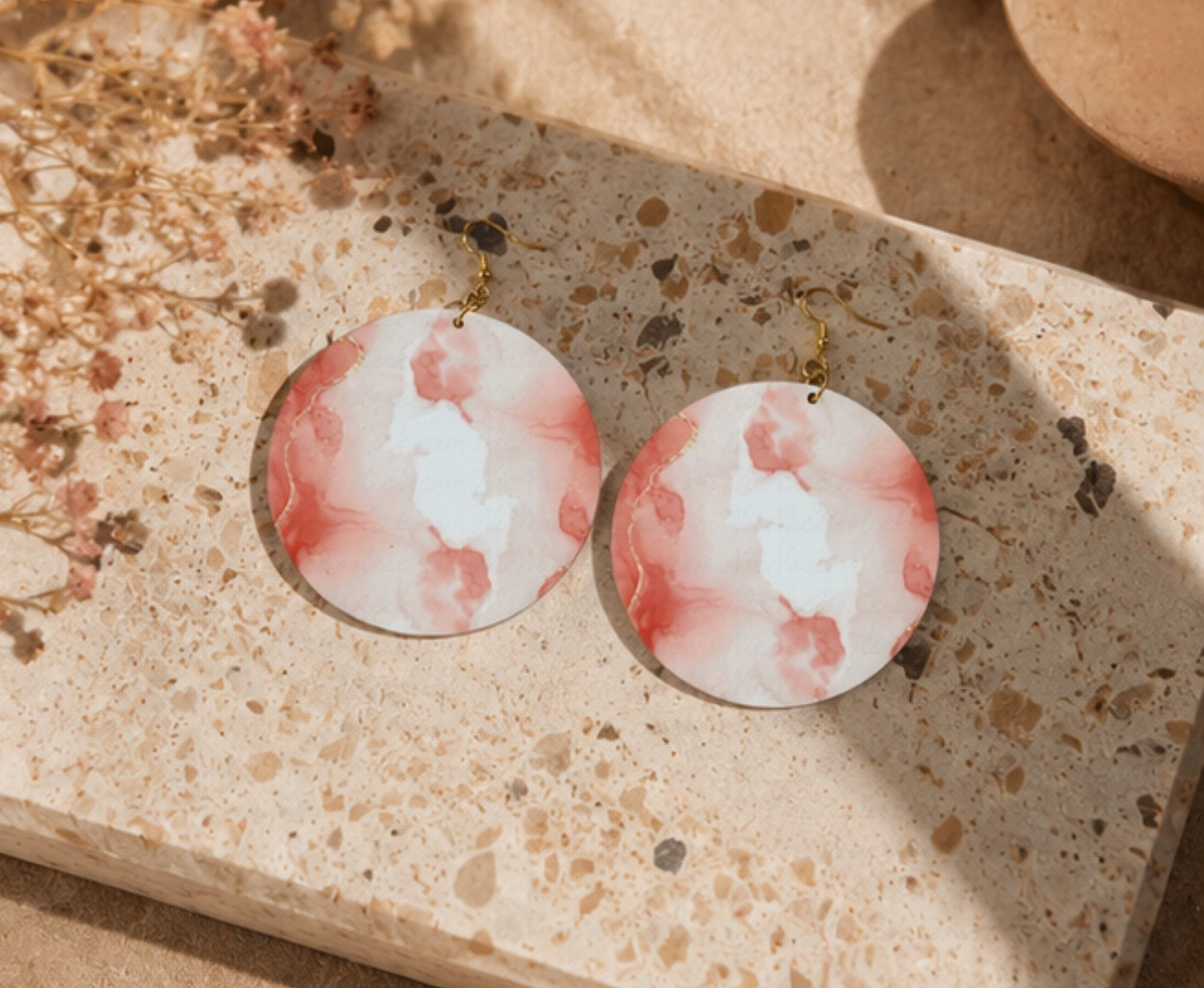 Rose Mist Statement Earrings hanging on a modern gold jewelry stand featuring soft rose artwork and elevated boutique styling by NicNacBooteek.