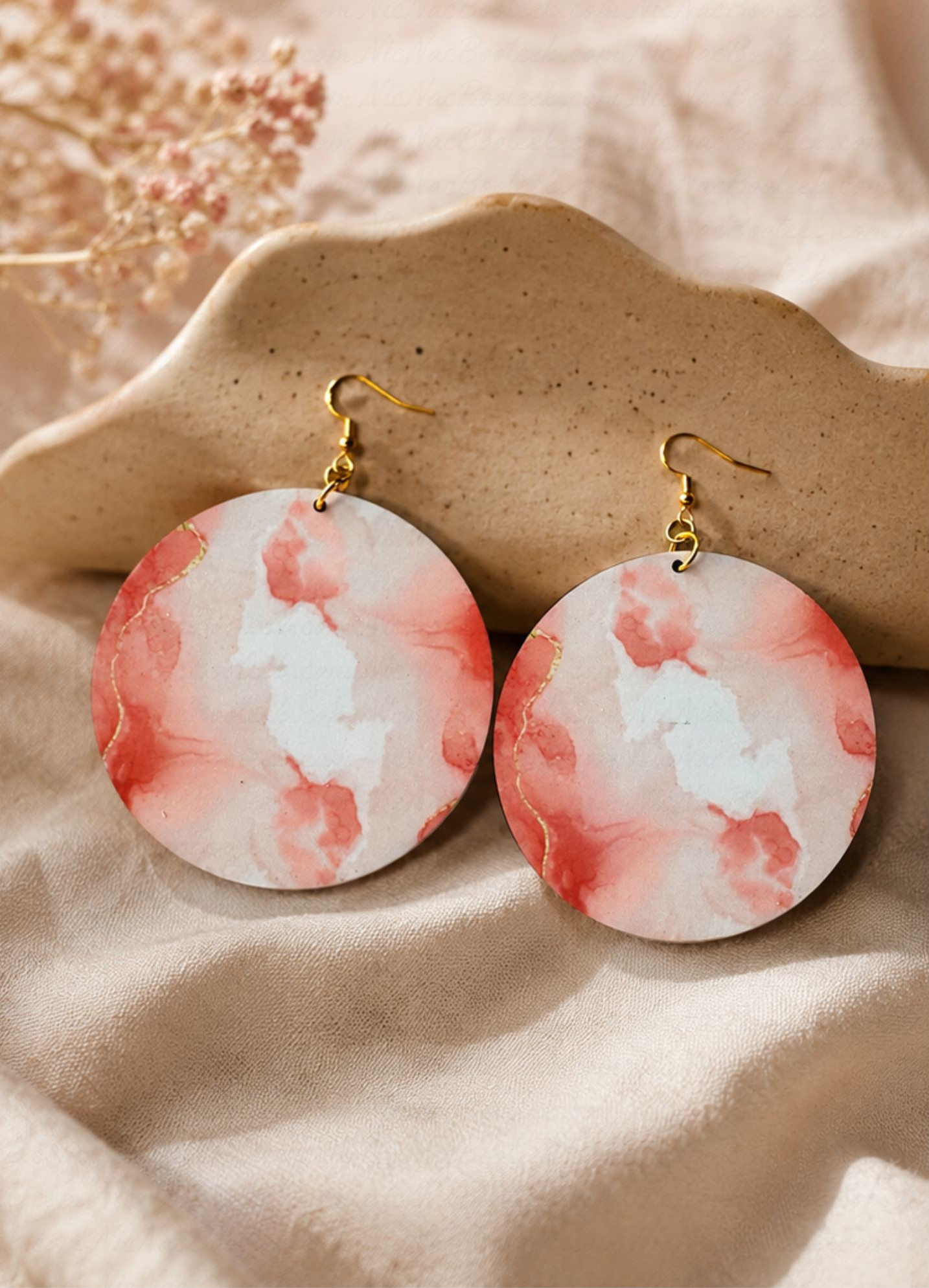 Rose Mist Statement Earrings styled on soft satin fabric featuring rose watercolor-inspired artwork and elegant gold-tone hooks by NicNacBooteek.